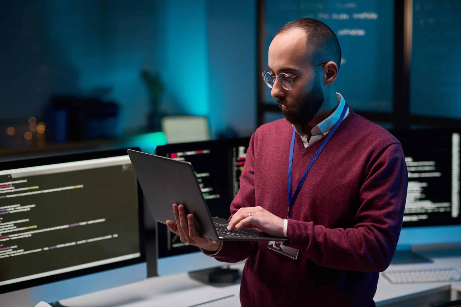 bearded man holding laptop in cybersecurity office 2024 08 01 19 47 01 utc 1 scaled